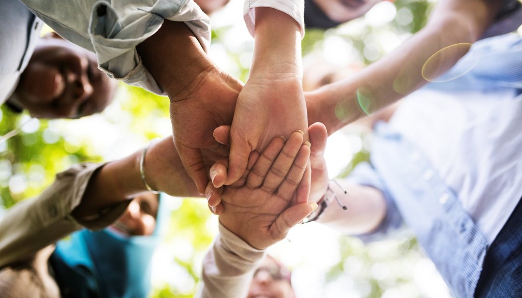 group_of_diverse_youth_hands_joined_2025_02_10_11_09_27_utc_min