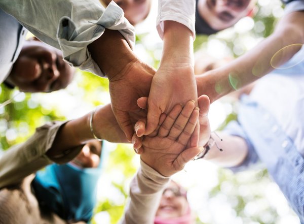 group_of_diverse_youth_hands_joined_2025_02_10_11_09_27_utc_min